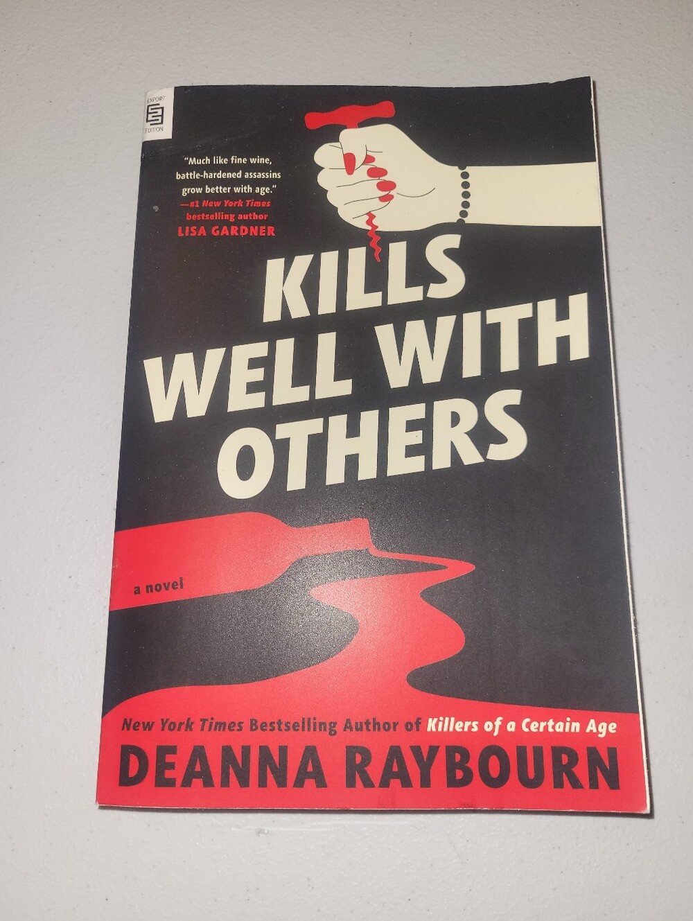 "Kills Well With Others" - Black & Red Paperback Book